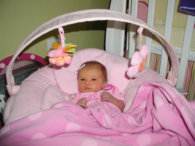 Molly tries out the bouncy seat.