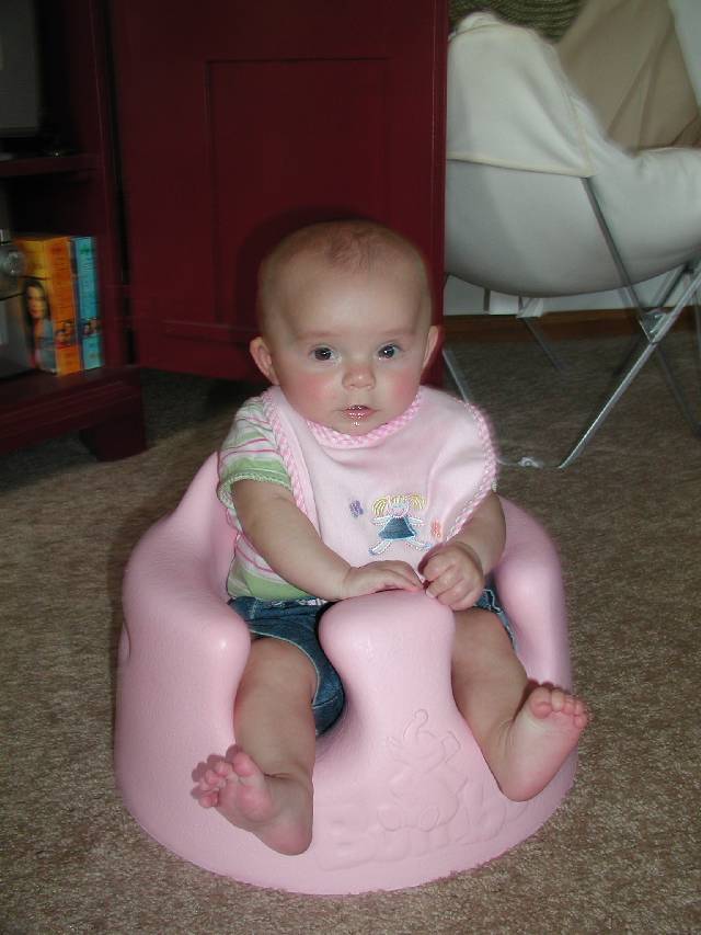 Chloe tries out Molly's Bumbo to make sure that it works.